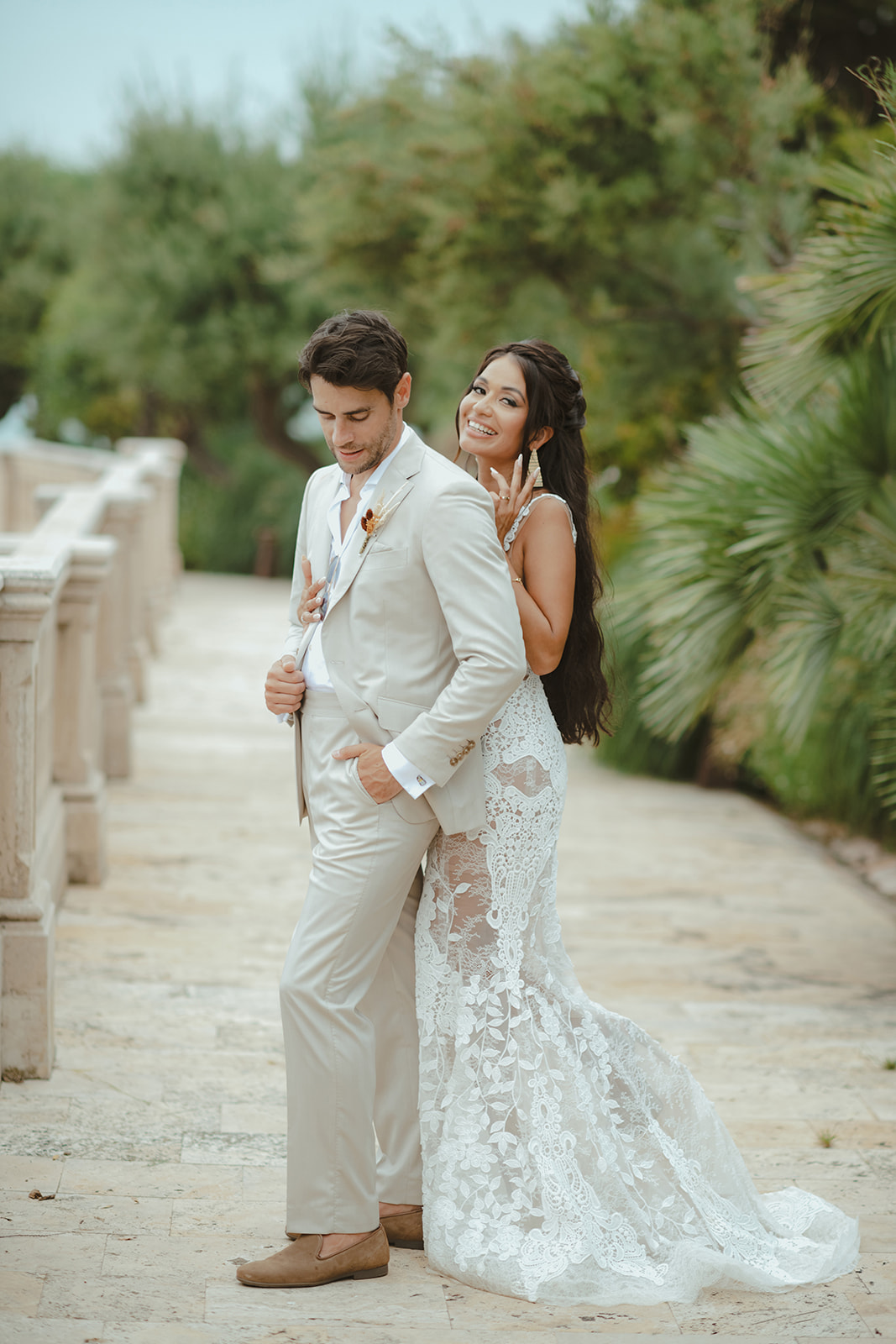 Bride and groom walking through the gardens of Xalet del Nin